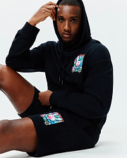 Black relaxed fit hoodie and Mens Isaac Print Short, both in soft jersey, featuring a vibrant multi-color Psycho Bunny skull logo on the left chest and left thigh.