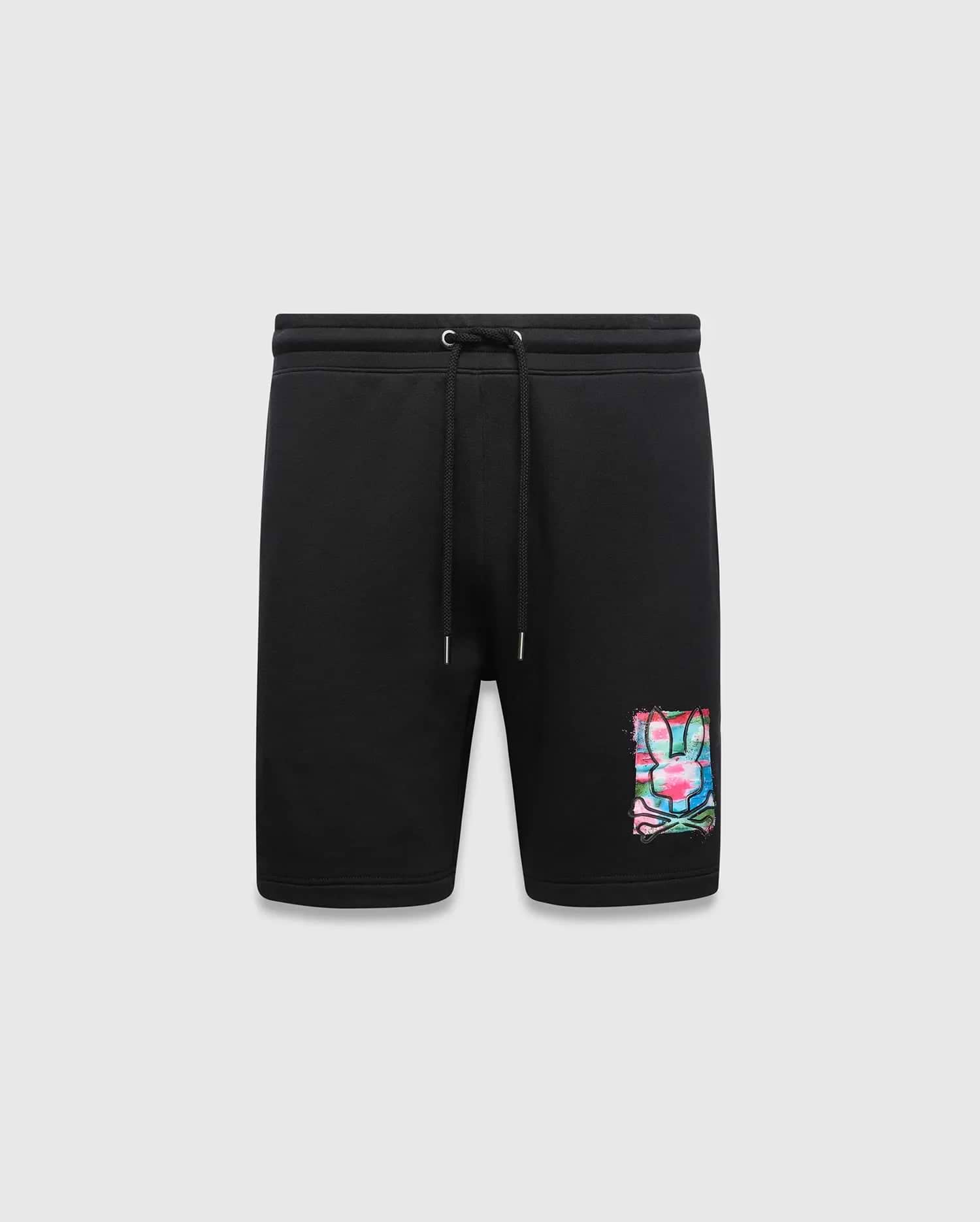 Mens Isaac Print Short, black classic fit jersey shorts featuring a drawstring waist and a large, vibrant multi-color paint splatter Psycho Bunny skull logo graphic on the lower left leg.