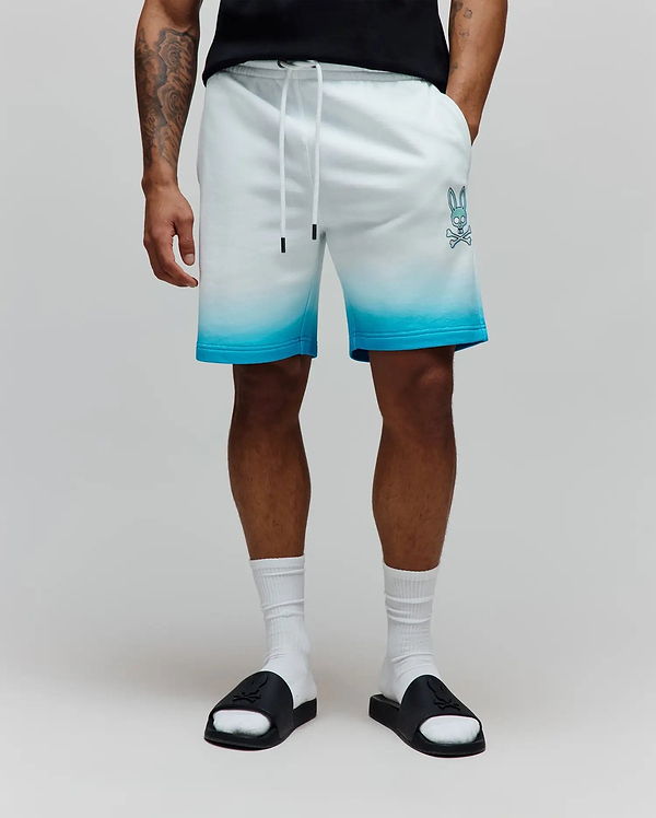 Mens Dax Sweatshort featuring a relaxed fit, soft french terry fabric, white to bright blue ombre design, and a prominent light blue Psycho Bunny skull logo on the left thigh.