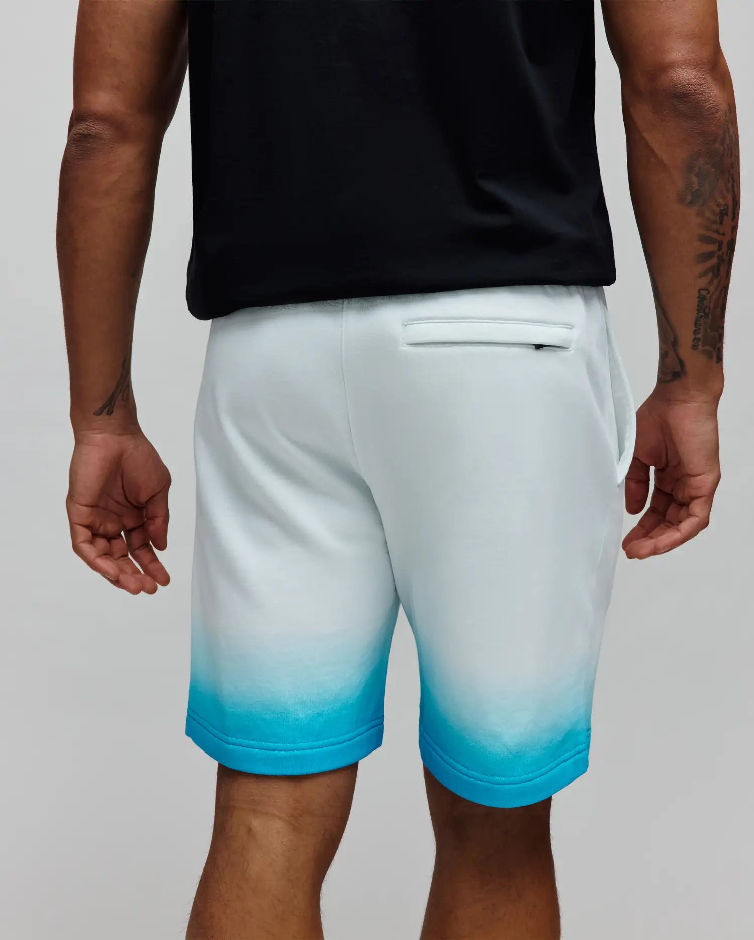 Mens Dax Sweatshort, a relaxed fit white French terry sweatshort with an ombre fade to vibrant turquoise at the hem and a back welt pocket. (3)