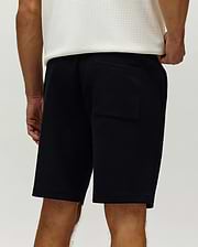 Mens Maxton Waffle Sweatshort, black, featuring a relaxed fit, prominent waffle knit texture, side pockets, and a rear patch pocket. (3)