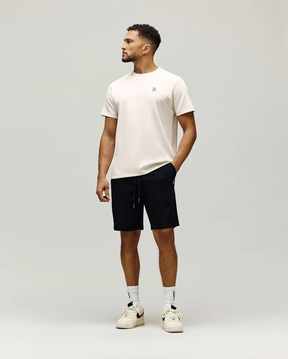 Cream jersey t-shirt with small embroidered bunny skull logo chest, and black Mens Maxton Waffle Sweatshort with drawstring, small bunny skull logo thigh. (4)