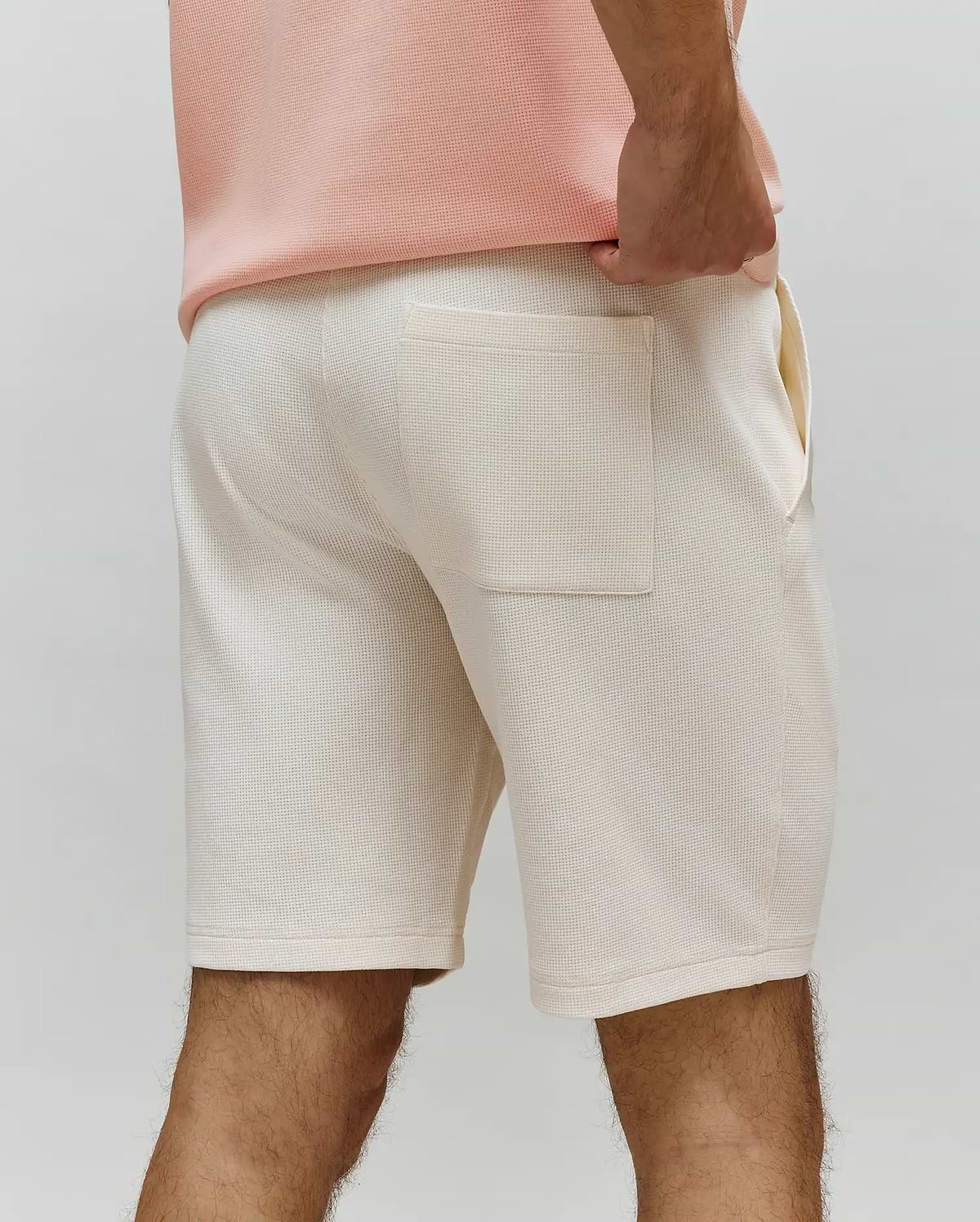 Mens Maxton Waffle Sweatshort in cream, featuring a comfortable, relaxed fit, soft waffle knit fabric, and a single back patch pocket with side pockets.