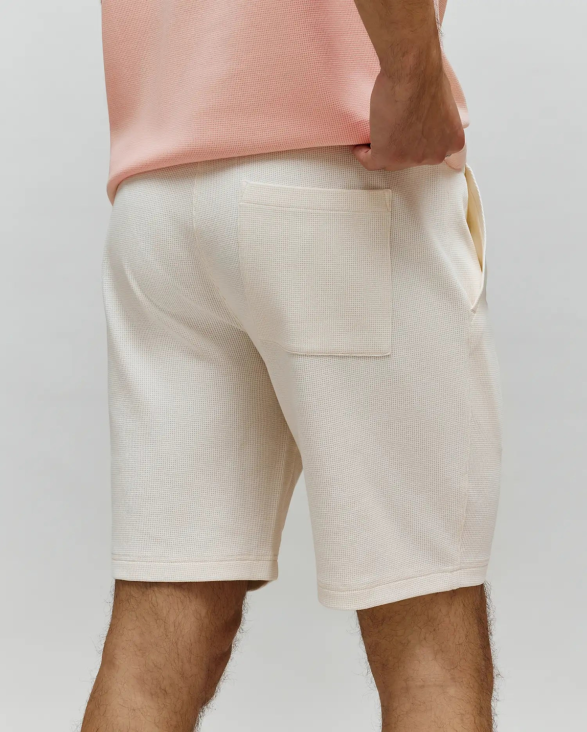 Mens Maxton Waffle Sweatshort in cream, featuring a comfortable, relaxed fit, soft waffle knit fabric, and a single back patch pocket with side pockets.