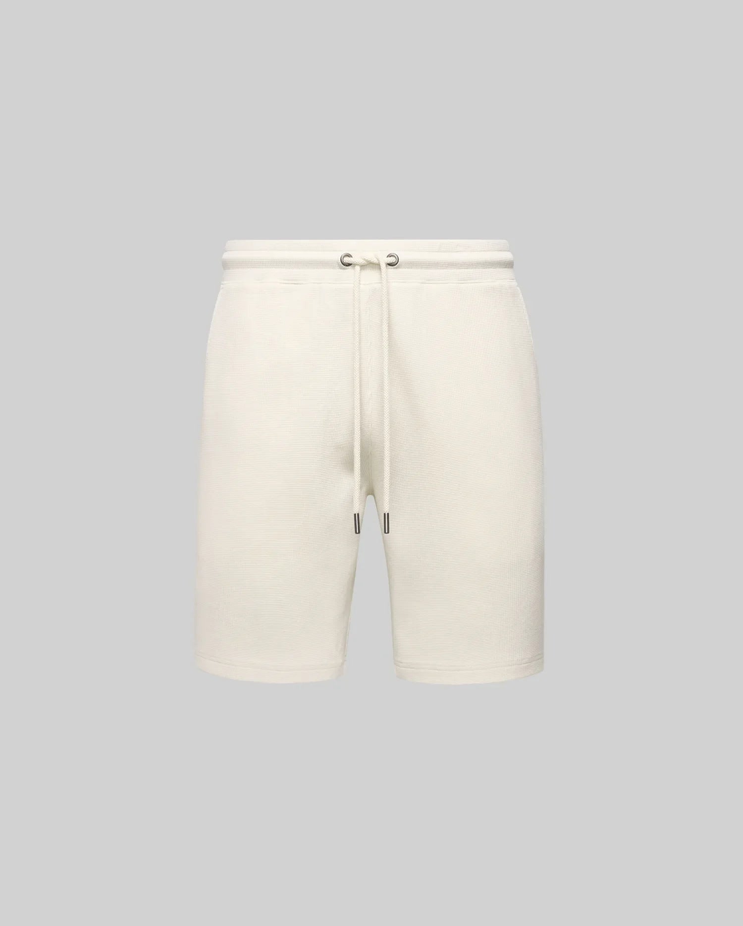 Mens Maxton Waffle Sweatshort in cream, a relaxed fit garment with a soft waffle knit texture, featuring a drawstring waist with dark metal tips. No visible Psycho Bunny logo.