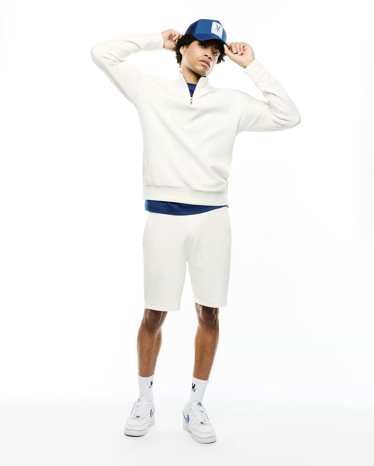 Cream textured quarter-zip sweatshirt with a small embroidered Psycho Bunny skull logo on the left chest, paired with matching MENS MARC TEXTURED SHORT, featuring a classic fit. (3)