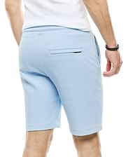 Mens Marc Textured Short in light blue, featuring a relaxed fit, all-over pique texture, and small embroidered Psycho Bunny text above the back welt pocket.