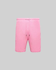 Mens Garen Knit Short in vibrant pink, featuring a textured knit fabric, relaxed fit, drawstring waist with silver aglets, and a small embroidered Psycho Bunny skull logo on the right thigh. (4)