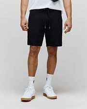 Mens Garen Knit Short, black textured knit with a relaxed fit, featuring a drawstring waist with silver tips and a subtle tonal embroidered Psycho Bunny logo on the left thigh. (1)