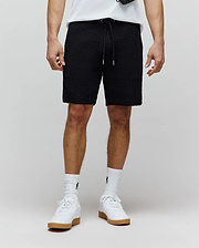 Mens Garen Knit Short, black textured knit with a relaxed fit, featuring a drawstring waist with silver tips and a subtle tonal embroidered Psycho Bunny logo on the left thigh. (1)