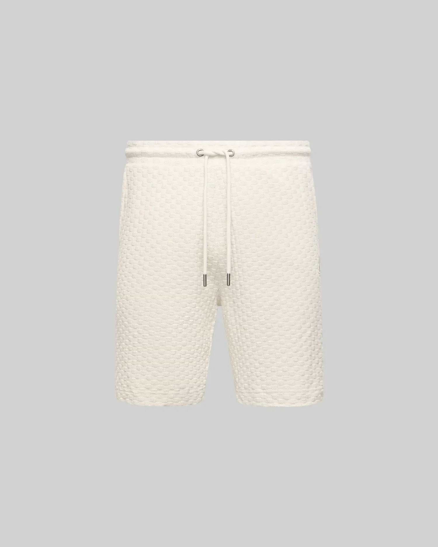 Mens Garen Knit Short in cream, featuring a relaxed fit and a distinctive waffle knit texture with a comfortable drawstring waist and sleek silver-tipped cords. (4)