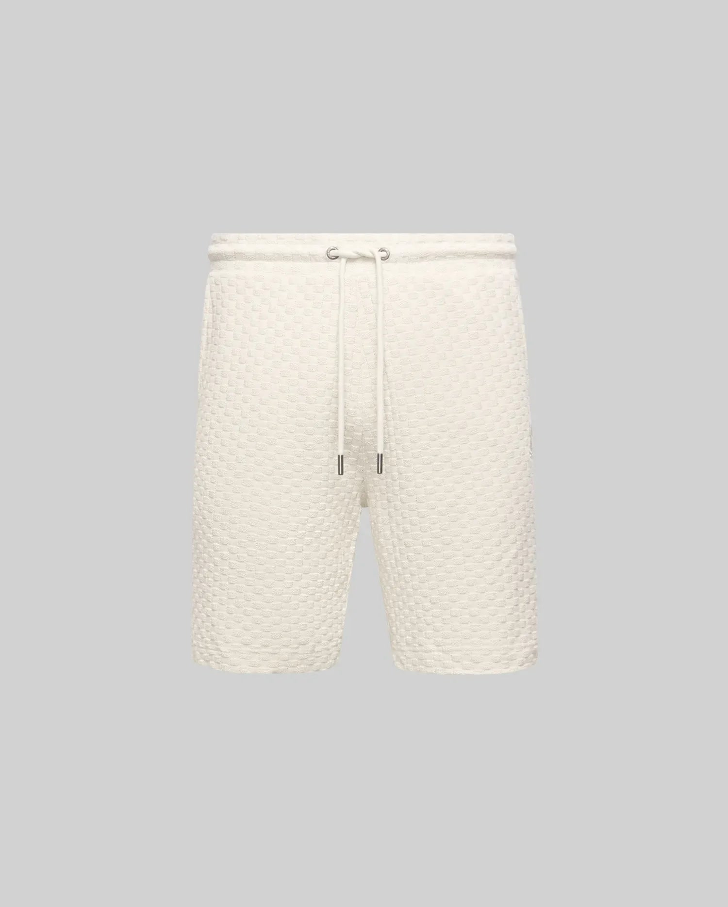 Mens Garen Knit Short in cream, featuring a relaxed fit and a distinctive waffle knit texture with a comfortable drawstring waist and sleek silver-tipped cords. (4)