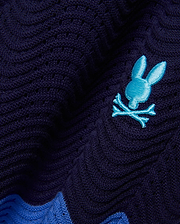 Mens Holden Knit Short 6, navy open-knit with a wavy texture, featuring a vibrant blue embroidered Psycho Bunny skull logo and a bold accent stripe.