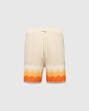 Mens Holden Knit Short 6, a cream relaxed fit knit short with a wavy texture and a bold orange and yellow gradient stripe pattern at the hem, featuring a drawstring waist.