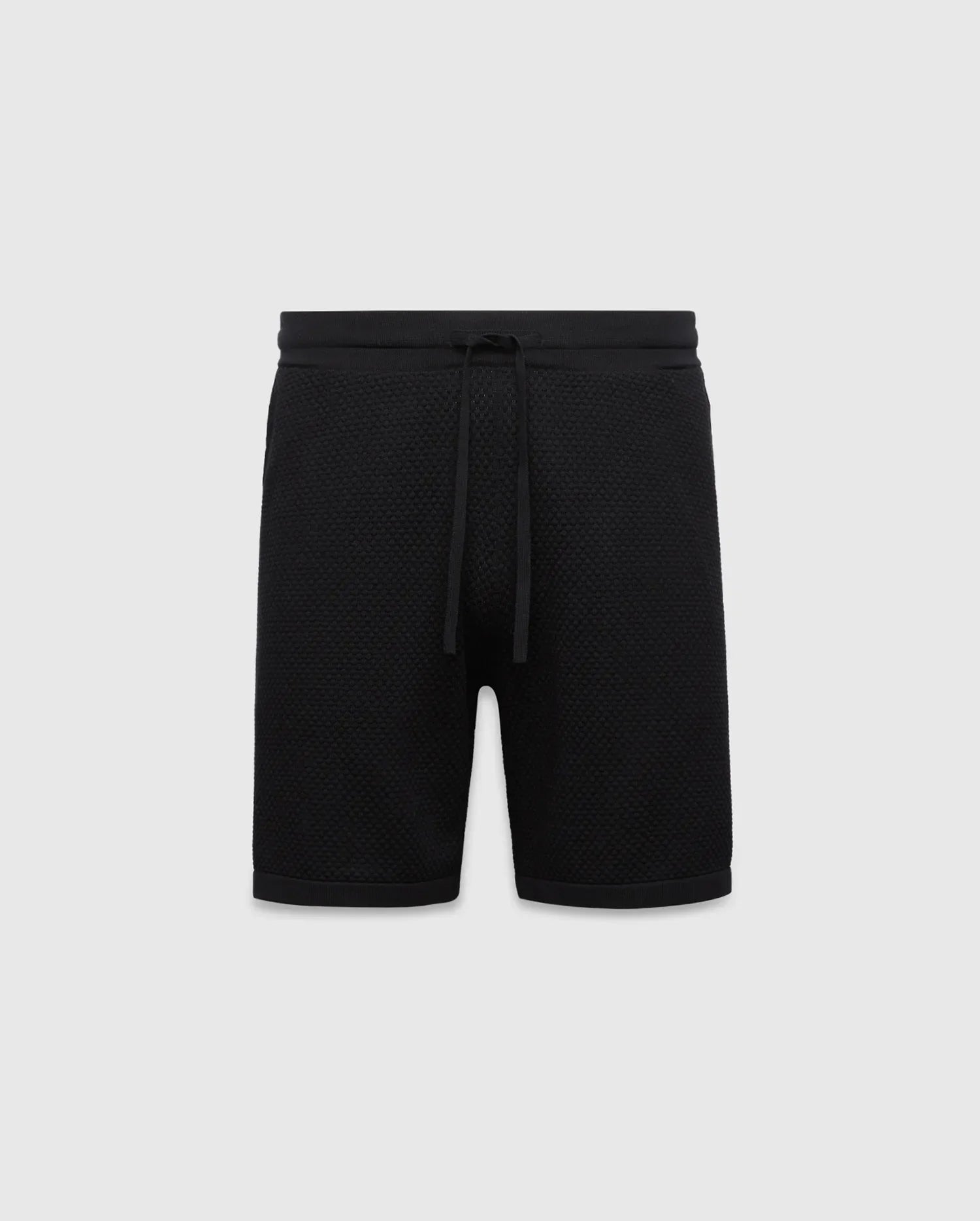 Black MENS DEVON KNIT SHORT with a relaxed fit, featuring a textured knit fabric, ribbed waistband, and drawstring closure. No visible Psycho Bunny logo.