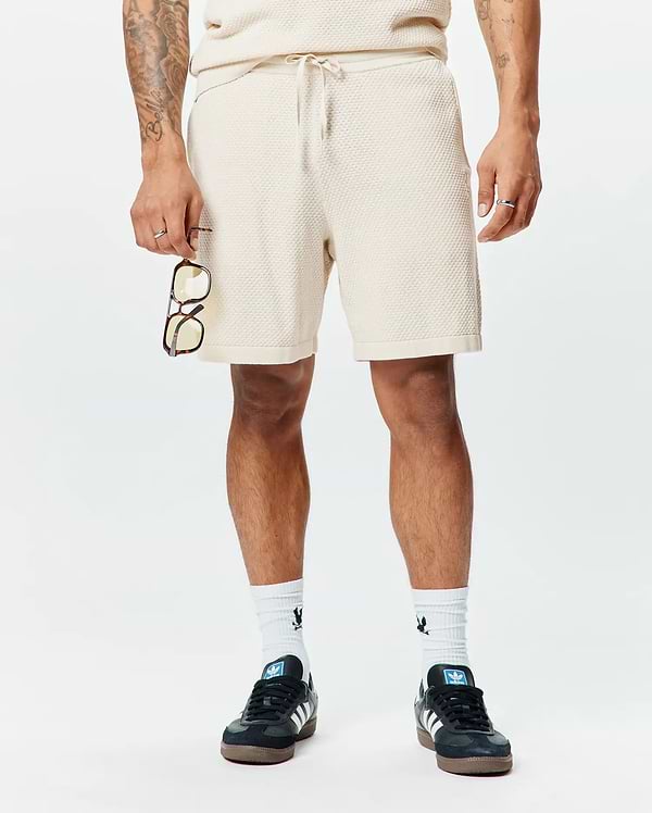 Mens Devon Knit Short, a premium relaxed fit cream textured waffle knit short, featuring a comfortable drawstring waist, soft hand feel, and refined streetwear style.