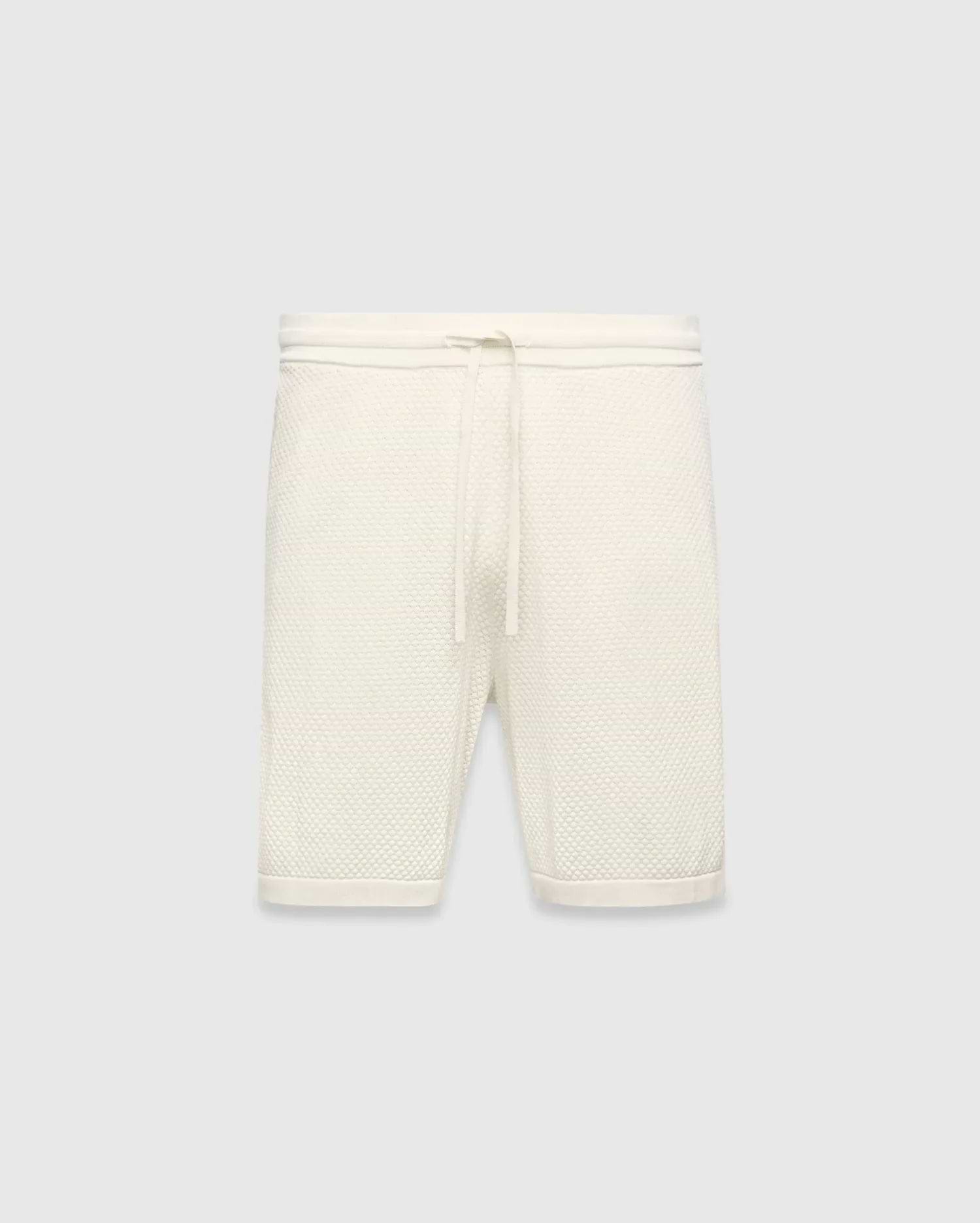 Mens Devon Knit Short in cream, a relaxed fit short crafted from a distinctive textured waffle knit fabric, featuring a ribbed waistband and an adjustable drawstring.