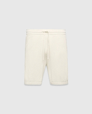 Mens Devon Knit Short in cream, a relaxed fit short crafted from a distinctive textured waffle knit fabric, featuring a ribbed waistband and an adjustable drawstring.
