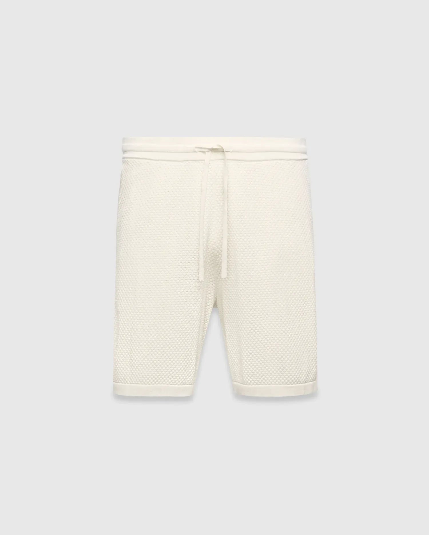 Mens Devon Knit Short in cream, a relaxed fit short crafted from a distinctive textured waffle knit fabric, featuring a ribbed waistband and an adjustable drawstring.
