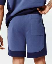 Mens Kelly Short: Relaxed fit heather blue jersey shorts featuring dark navy color-block side panels, an elastic waistband, and a single back patch pocket. (3)