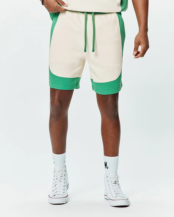 Mens Kelly Short, a relaxed fit cream French terry short with curved kelly green color-block side panels and a matching green drawstring.