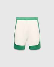 Mens Kelly Short, a color-blocked design with vibrant green outer panels and a cream central panel, featuring a small embroidered Psycho Bunny skull logo on the lower left leg. Smooth knit fabric, classic fit. (5)