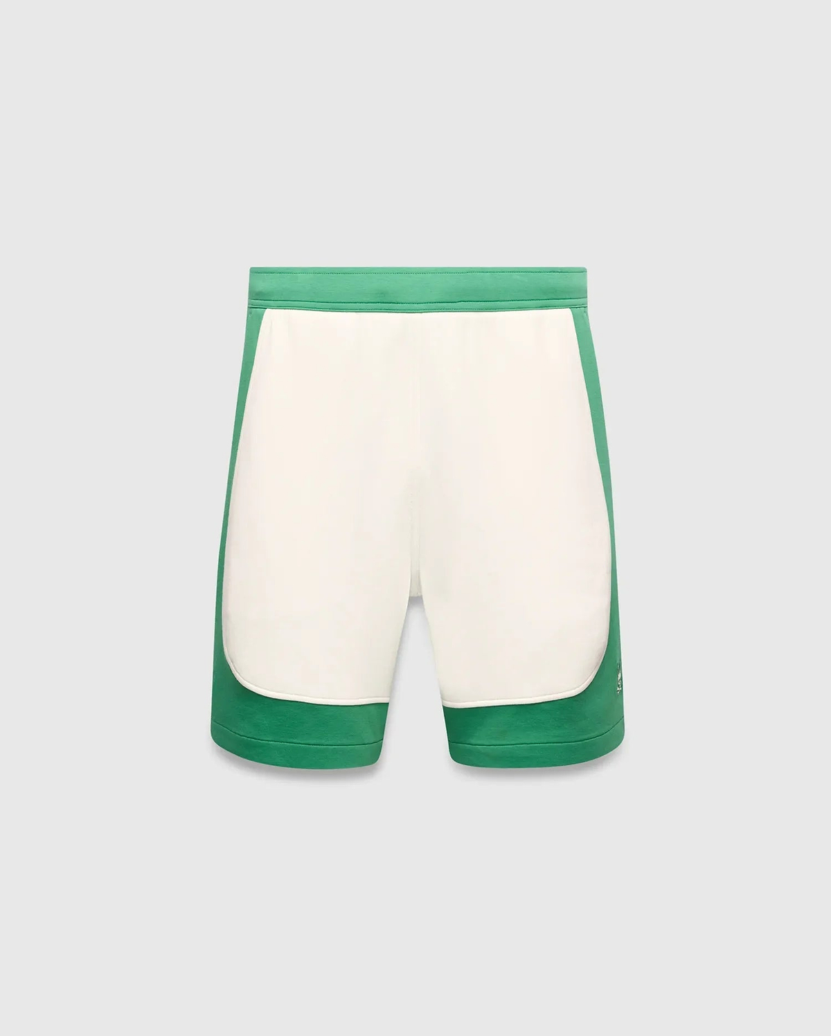 Mens Kelly Short, a color-blocked design with vibrant green outer panels and a cream central panel, featuring a small embroidered Psycho Bunny skull logo on the lower left leg. Smooth knit fabric, classic fit. (5)