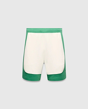Mens Kelly Short, a color-blocked design with vibrant green outer panels and a cream central panel, featuring a small embroidered Psycho Bunny skull logo on the lower left leg. Smooth knit fabric, classic fit. (5)