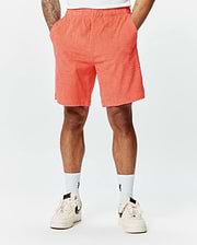 Mens Tristan Short in vibrant coral, a relaxed fit short with an all-over raised quilted diamond pattern on soft, textured terry fabric, perfect for refined streetwear.