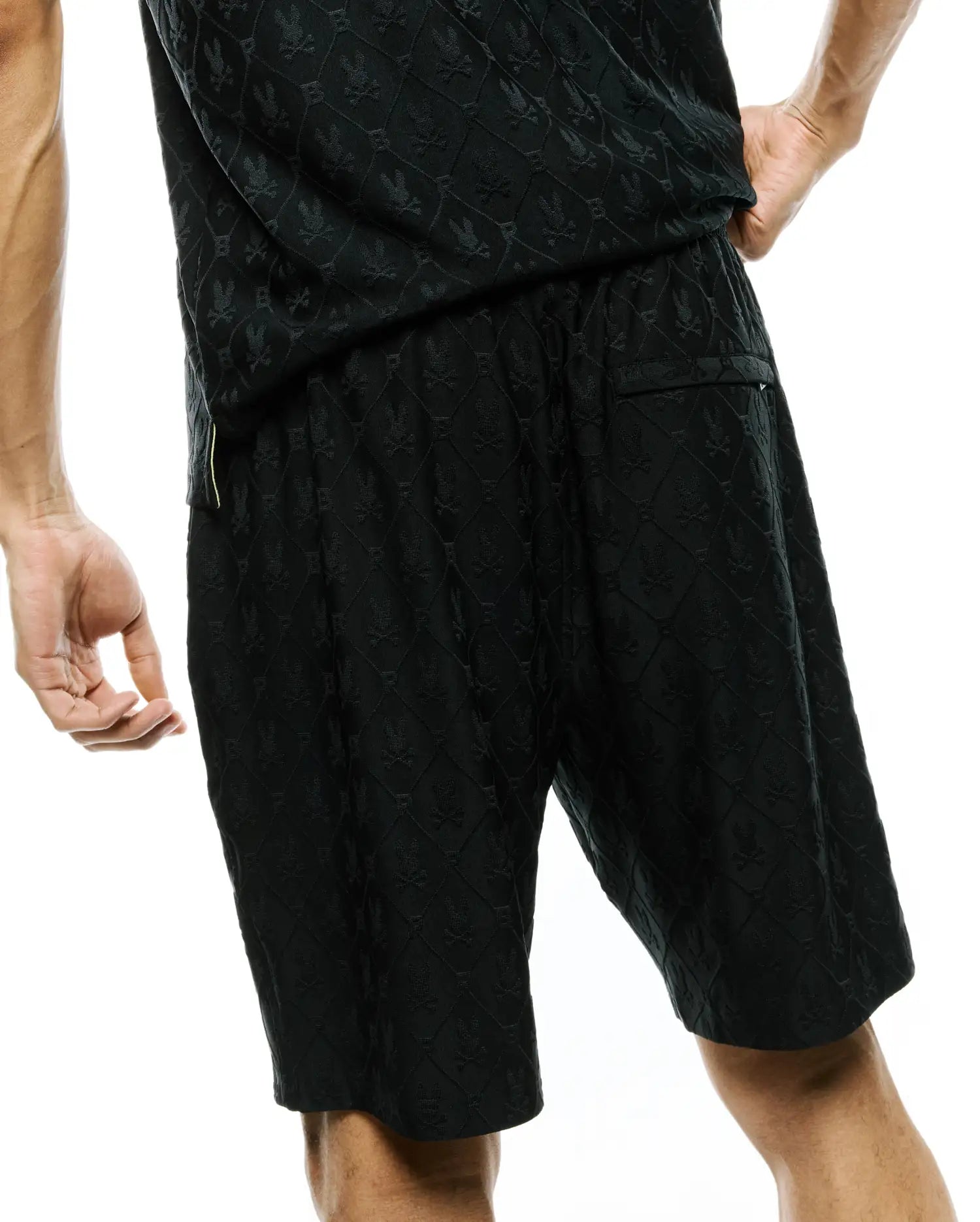 Mens Garry Jacquard Sweatshort in black, featuring a relaxed fit and an all-over tonal jacquard pattern of the iconic Psycho Bunny skull logo.