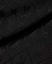 Mens Garry Jacquard Sweatshort in black, featuring a tonal all-over jacquard knit pattern of the iconic Psycho Bunny skull logo and PB initials.