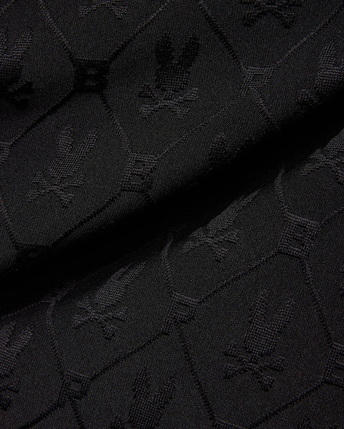 Mens Garry Jacquard Sweatshort in black, featuring a tonal all-over jacquard knit pattern of the iconic Psycho Bunny skull logo and PB initials.