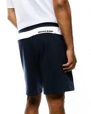 Mens Gabe French Terry Sweatshort, navy, relaxed fit, soft French terry fabric, with a white back waistband featuring a bold black Psycho Bunny text logo. (4)
