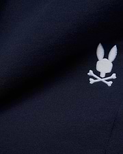 Premium deep navy blue MENS GABE FRENCH TERRY SWEATSHORT, showcasing a soft French terry knit texture and an iconic, crisp white embroidered Psycho Bunny skull logo, embodying refined streetwear style. (7)