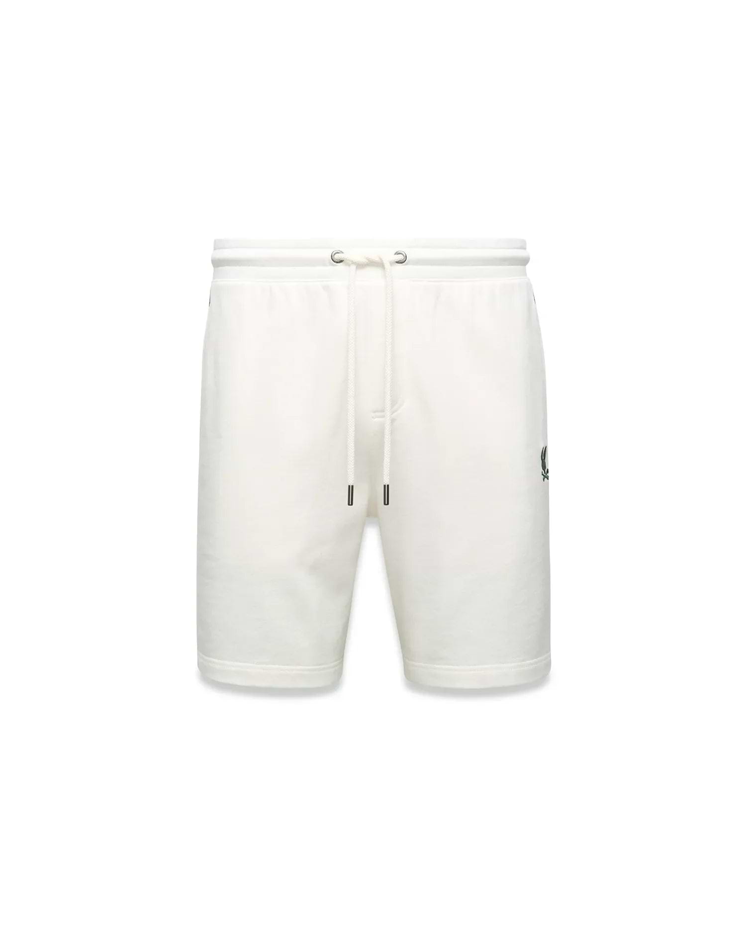Mens Gabe French Terry Sweatshort in cream, featuring a relaxed fit, soft French terry fabric, elastic drawstring waist with silver eyelets, and a small embroidered black Psycho Bunny skull logo on the left thigh.