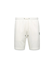 Mens Gabe French Terry Sweatshort in cream, featuring a relaxed fit, soft French terry fabric, elastic drawstring waist with silver eyelets, and a small embroidered black Psycho Bunny skull logo on the left thigh.