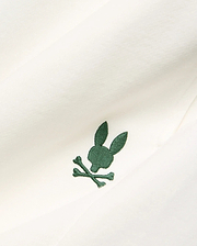 Cream Mens Gabe French Terry Sweatshort, featuring a small, intricately embroidered dark green Psycho Bunny skull and crossbones logo on soft French terry fabric.
