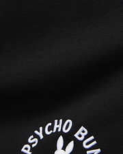 Mens Stevie Short in black, crafted from a smooth, dense knit fabric, prominently featuring the iconic white embroidered Psycho Bunny text and partial bunny skull logo.