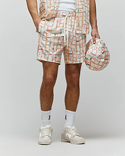 Mens Atlas Swim Trunk in cream with a vibrant multicolor plaid pattern featuring small repeated Psycho Bunny skull logos and a drawstring waist with Psycho Bunny text, relaxed fit.