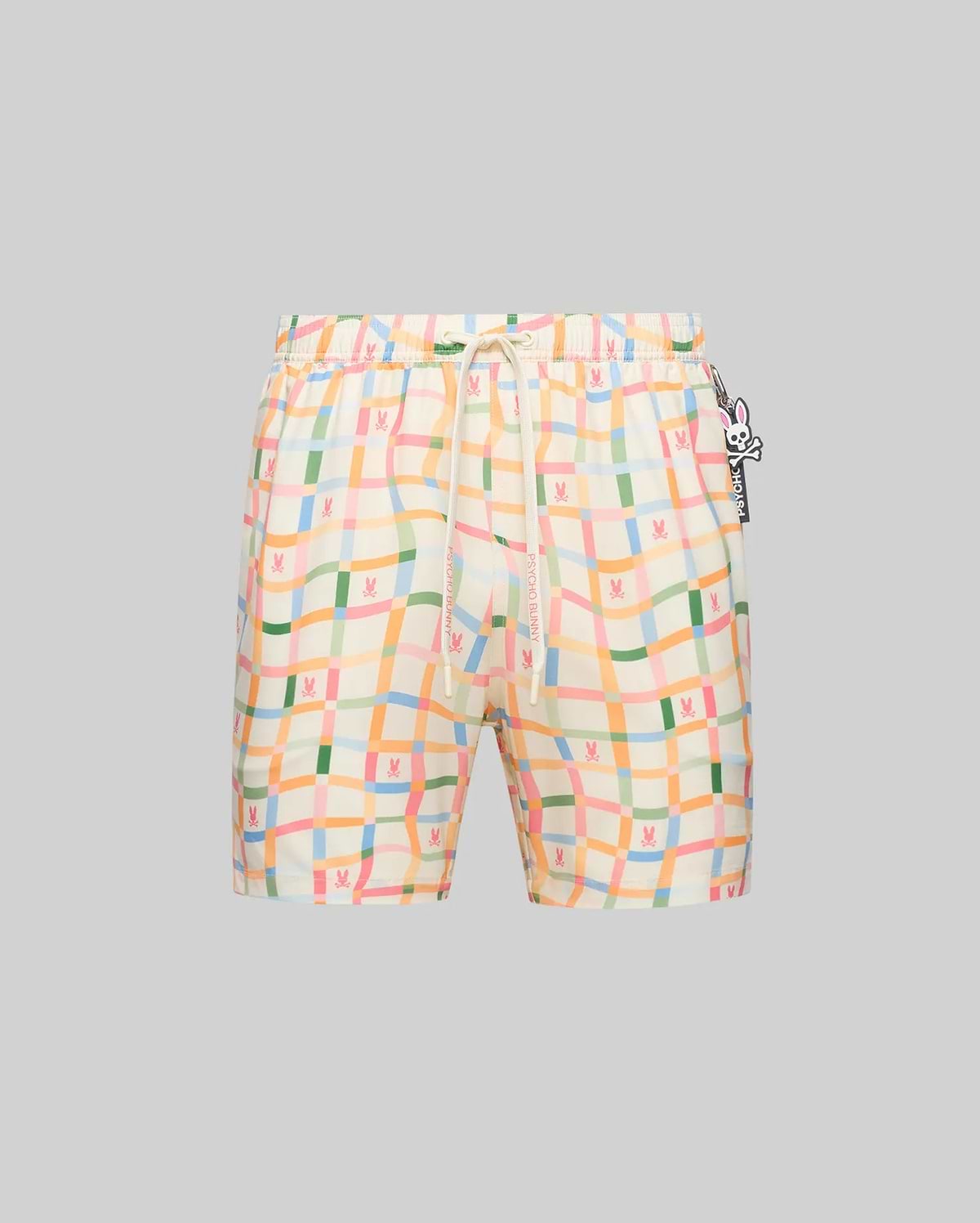 Mens Atlas Swim Trunk, cream relaxed-fit swim trunk with pastel wavy plaid in pink, green, blue, orange, featuring small repeated bunny skull logos, Psycho Bunny drawstring, and a large bunny skull keychain.