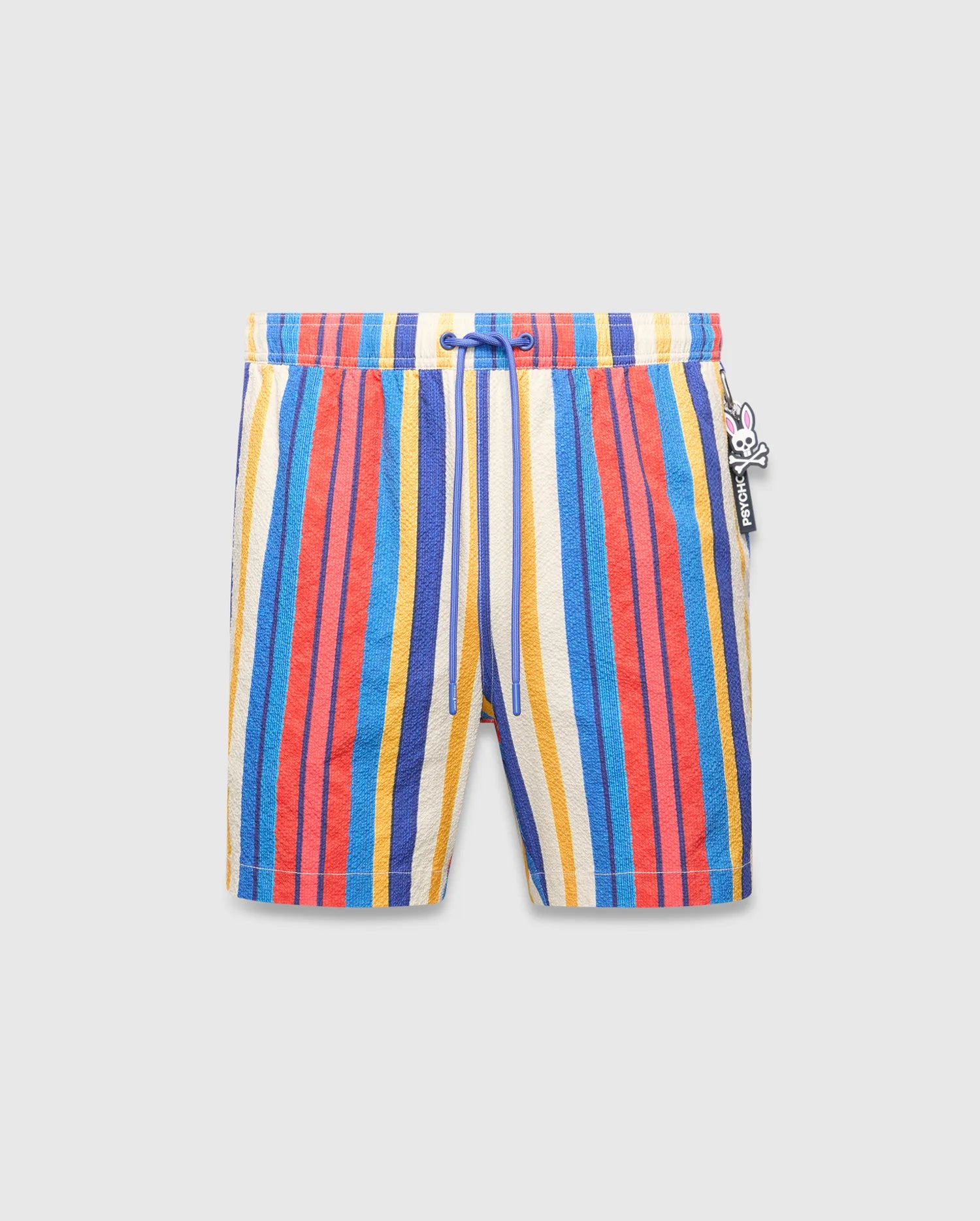 Mens Hubert Swim Trunk featuring vibrant multi-color vertical stripes in cream, blue, red, and yellow, with a textured fabric, royal blue drawstring, and a small Psycho Bunny skull logo charm on the right side.