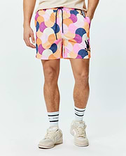 Mens Ethan Swim Trunk 6, featuring a vibrant multi-color abstract mosaic pattern in pink, orange, purple, and blue. Classic fit with a black Psycho Bunny skull logo on the left leg and branded drawstring. (1)