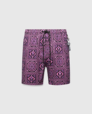 Mens Frank Swim Trunk 6, a vibrant purple and black mosaic pattern swim trunk with repeated Psycho Bunny skull and floral motifs, classic fit, and a Psycho Bunny charm on the black drawstring.