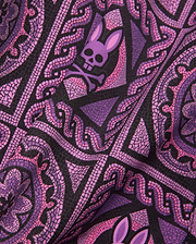 Mens Frank Swim Trunk 6 with a vibrant black, purple, and pink mosaic-style all-over print featuring repeated Psycho Bunny skull logos and intricate swirling patterns.