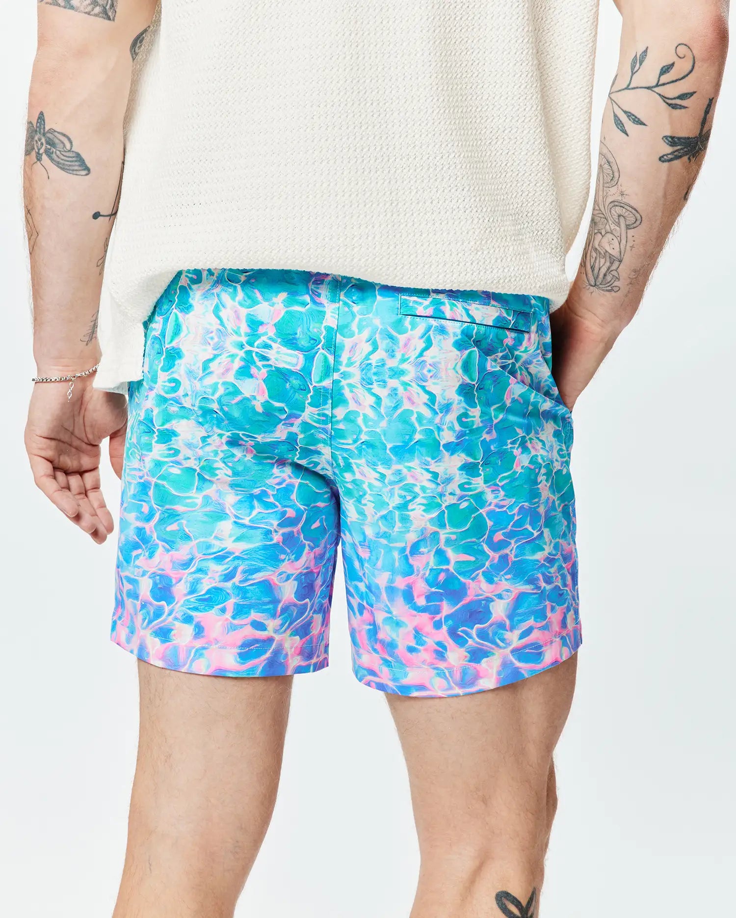 Mens Dayton Swim Trunk 6, a vibrant teal, blue, and pink water ripple print swim trunk with a classic fit and smooth, quick-dry fabric, embodying Psycho Bunny's bold aesthetic. (2)