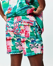 Mens Nate All Over Print Swim Trunk, a vibrant multi-color brushstroke pattern with repeated Psycho Bunny skull and crossbones logos and bunny outlines, featuring a relaxed fit and cargo pocket.