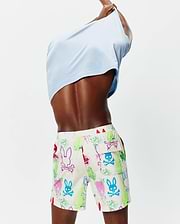Mens Quintin All Over Print Swim Trunk in cream with a vibrant graffiti-style multi-color Psycho Bunny skull and outline print, featuring a side cargo pocket and red drawstring, in a relaxed fit.