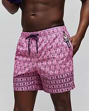 Mens Keon Swim Trunk, vibrant pink with a classic fit and smooth quick-dry fabric. Features an all-over navy grid print of Psycho Bunny heads and skull & crossbones, navy drawstring, and a small side logo tag. (2)
