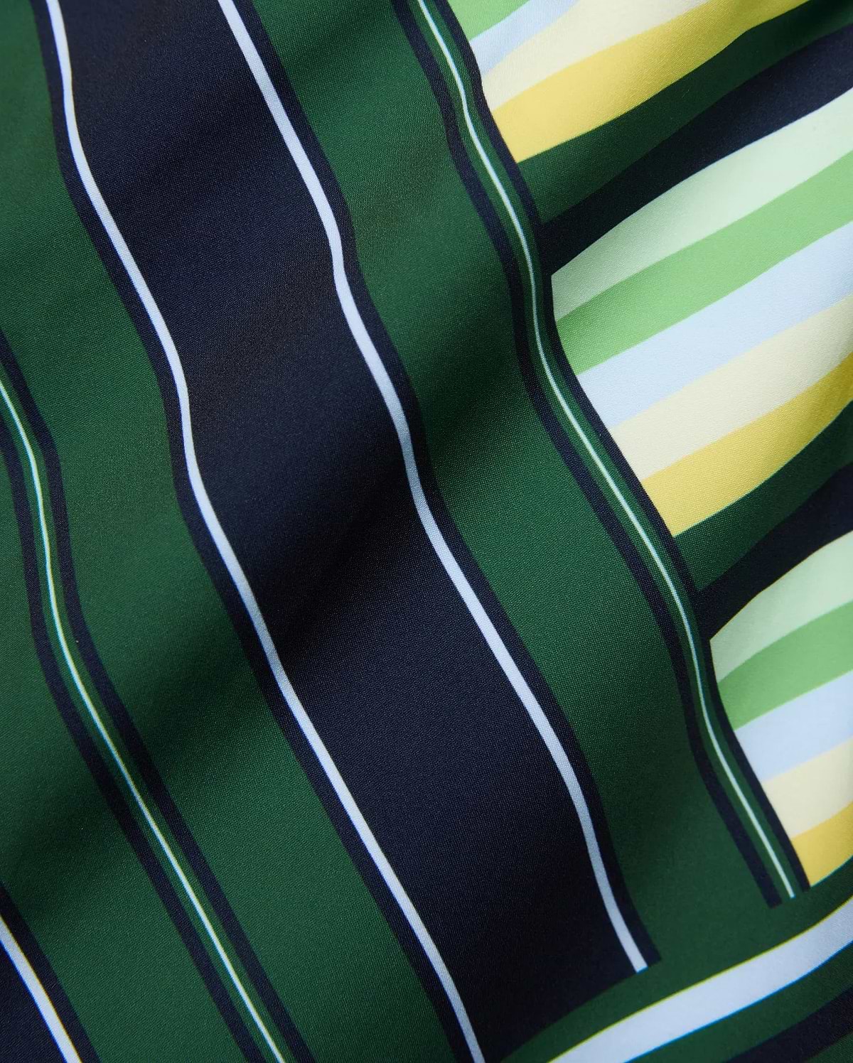 Mens Drew All Over Print Swim Trunk featuring a bold multi-directional stripe pattern in dark green, navy, white, light green, yellow, and light blue on smooth fabric. (6)