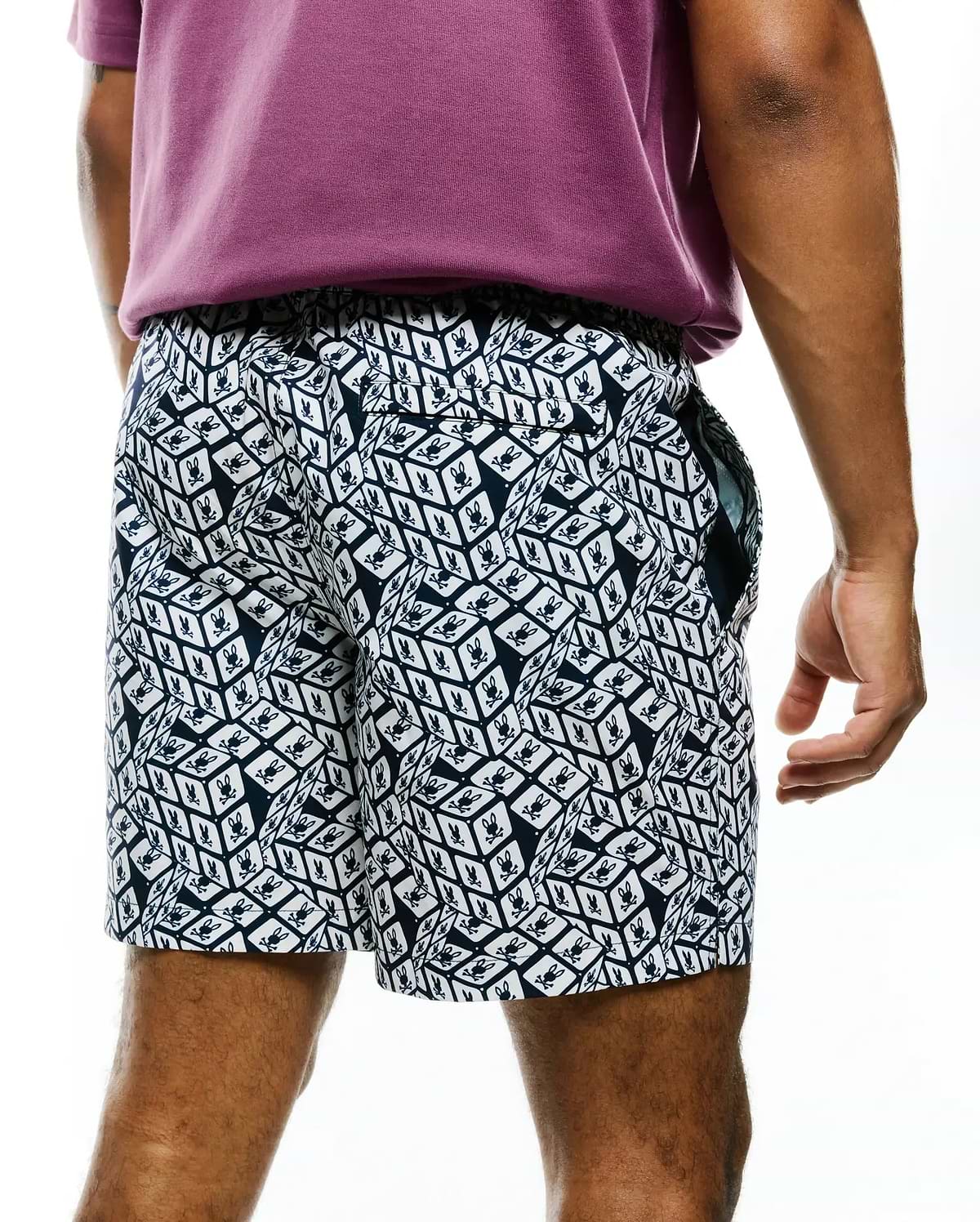 Mens Eddy All Over Print Swim Trunk in navy and white, featuring a relaxed fit, smooth quick-dry fabric, and an all-over geometric cube pattern with small Psycho Bunny skull logos. (2)